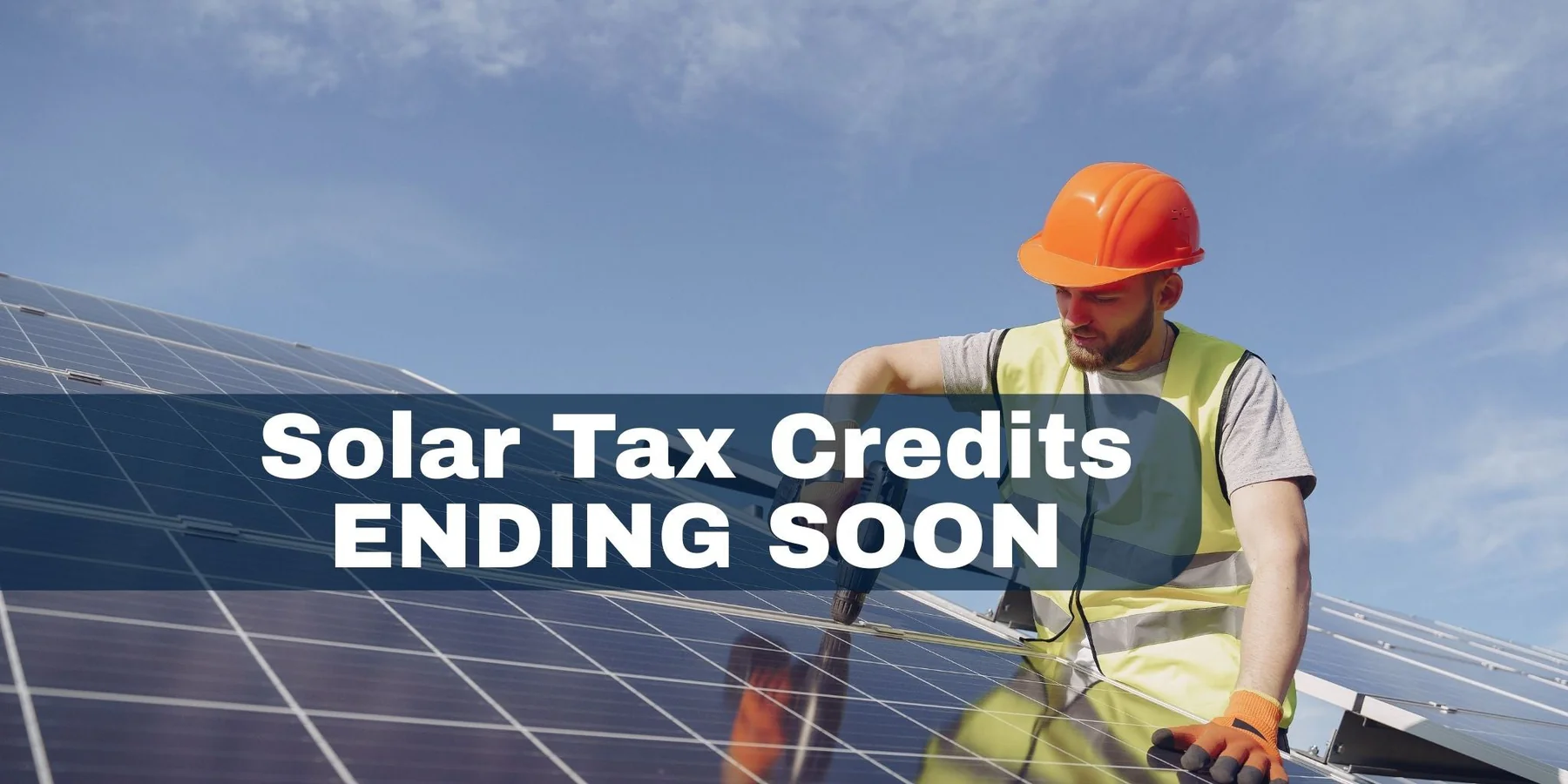 Man on roof installing solar panels